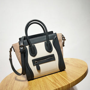 Extrem™ Cowhide smiley face shoulder bag